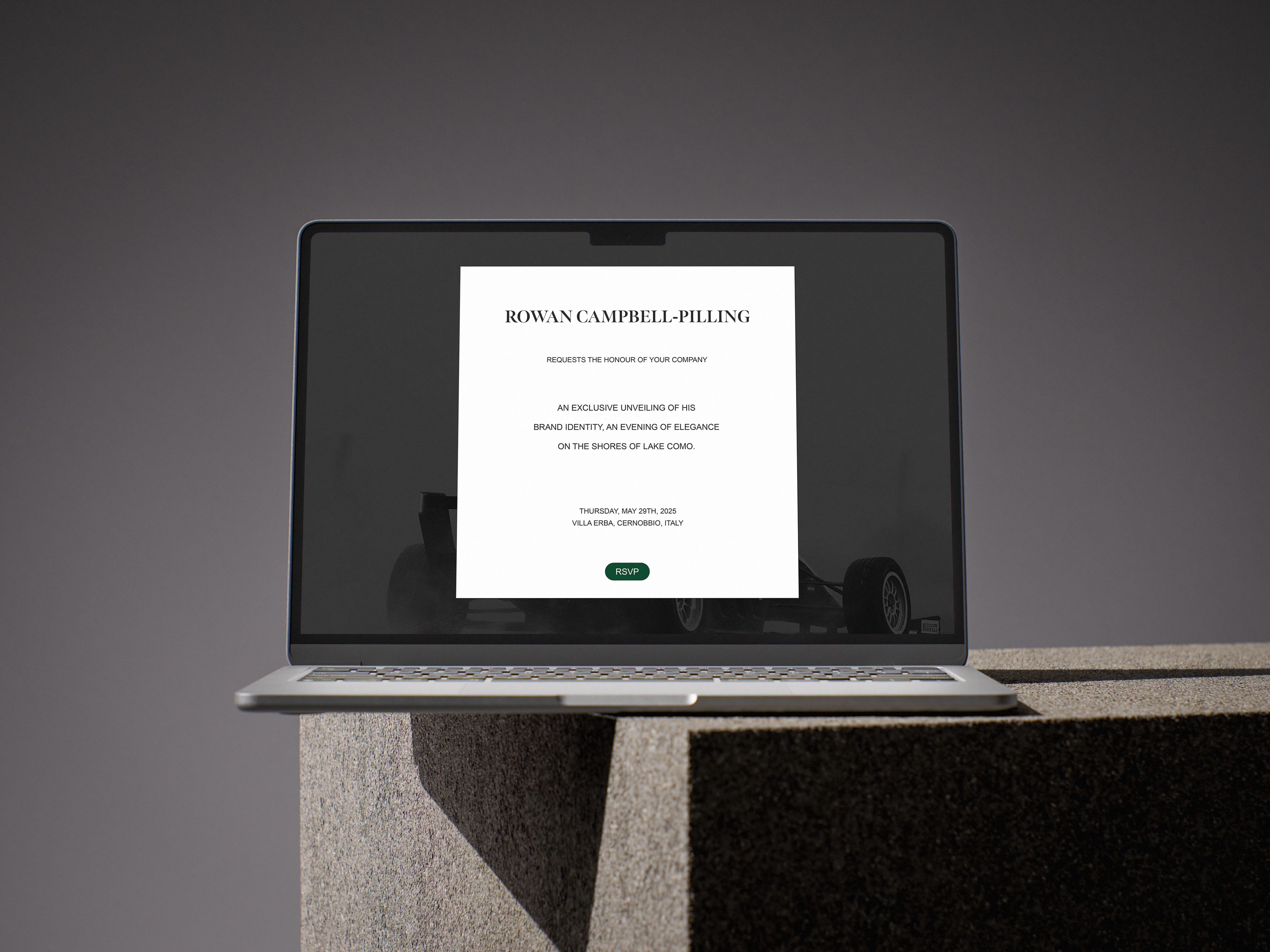 Conceptual brand reveal RSVP webpage displayed on a laptop